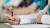 Medical student taking notes